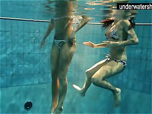2 fabulous amateurs showing their figures off under water